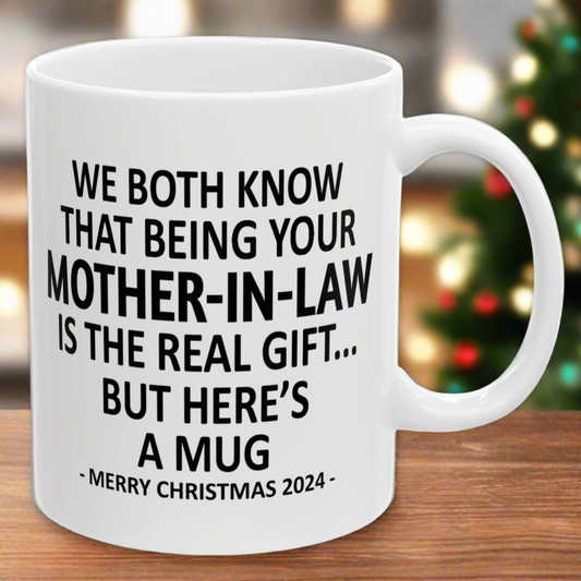 We Both Know Being Your Mother-In-Law Is The Real Gift, But Here's A Mug, Funny Christmas 2024 Gift Coffee Mugs 11oz