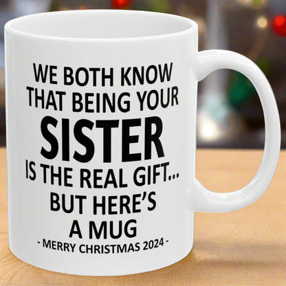 We Both Know That Being Your Sister Is The Real Gift, But Here's A Mug, Funny Christmas 2024 Gift Coffee Mugs 11oz